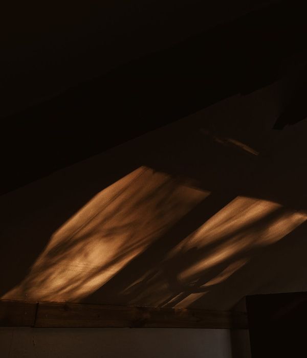 Abstract composition with warm orange light and dark shadows